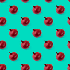 Seamless pattern with red onions on a green background. Minimalism. Food. Isometric