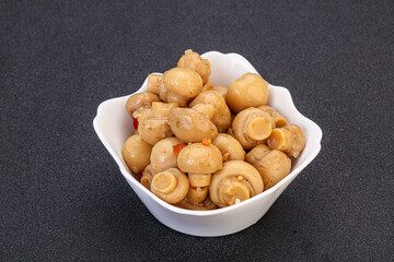Pickled champignons in the bowl
