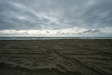 A Dramatic Stormy Sky Over a Dark Beach