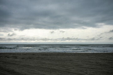 A Dramatic Stormy Sky Over a Dark Beach