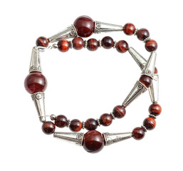 handcrafted necklace from brown agate and ox's eye beads and silver inserts isolated on white background