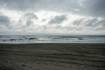 A Dramatic Stormy Sky Over a Dark Beach