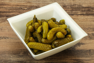 Pickled gherkin in the bowl