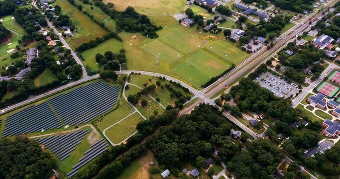 Solar Farm Borders Cemetery and Sports Complex Near Elon University. As we fly over Burlington, NC we pass over solar panels generating electricity that are located next to sports complex and cemetery