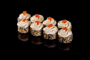 Fresh delicious beautiful sushi rolls on a dark background