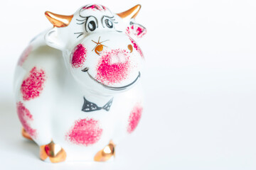 Porcelain figure of a bull, on a white background. Year of the bull