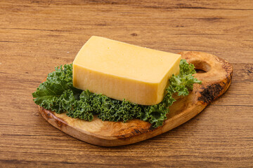 Tasty yelloow Tilsiter cheese brick