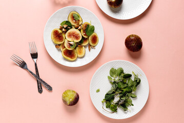 fig salad with almond and thyme herb on colored background