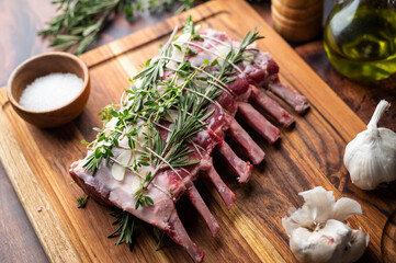 tied lamb rack with herbs for roast © ahirao