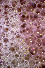 Air bubbles in the water and oil mixture create an artistic and imaginatively designed abstract background