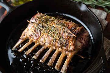 lamb rack roast on skillet pan © ahirao