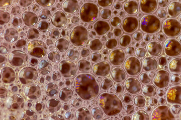 Air bubbles in the water and oil mixture create an artistic and imaginatively designed abstract...