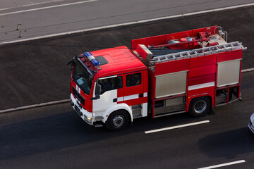 Russian firefighting services (EMERCOM) drive through the city streets, Russia, St. Petersburg, August 2020. Emergency service for the outbreak of coronavirus COVID-19