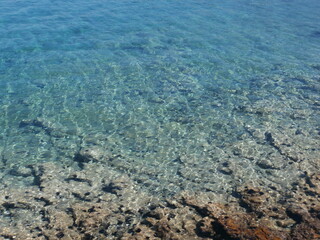 Clear blue water with patterns of sunlight