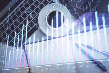 Stock market chart and top view computer on the table background. Double exposure. Concept of financial analysis.