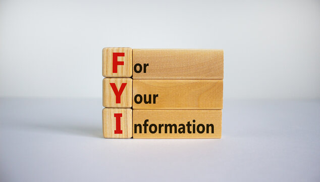 Wood blocks with acronym 'FYI' - 'for your information' on beautiful white background, copy space. Business concept.