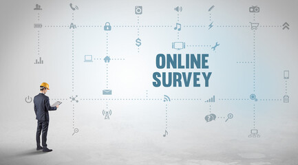 Engineer working on a new social media platform with ONLINE SURVEY inscription concept