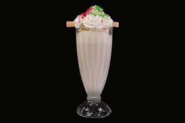Delicious Milkshake garnish with whipped cream in a glass,