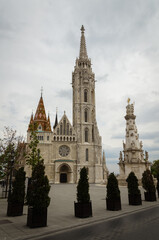 Fototapeta premium Gothic-style St. Matthias church in the castle district on a cloudy day, Budapest, Hungary
