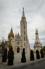 Fototapeta na wymiar Gothic-style St. Matthias church in the castle district on a cloudy day, Budapest, Hungary