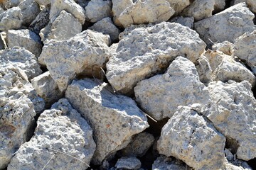 Stones and steel strips discarded from a construction site