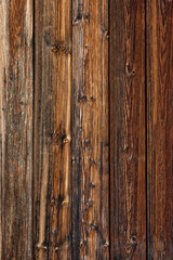 Brown wood texture. Abstract background, empty template. rustic weathered barn wood background with knots and nail holes. Close up of wall made of wooden planks. Grunge surface
