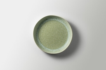 beautiful green plate on white background, top view