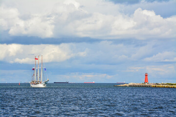 The sailing ship enters the port, beautiful landscape