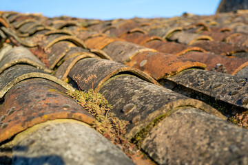 Old and ruined roofs. Texture of a roof with old roof tiles. Macro close up