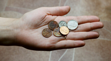 US coins, cents in hand, concept: poverty, success, loan, rich