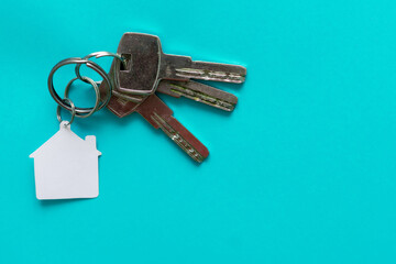 Set of Keys With White House Isolated on green Background.
