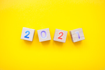 Happy New year 2021 celebration. The inscription 2021 from children's educational wooden cubes