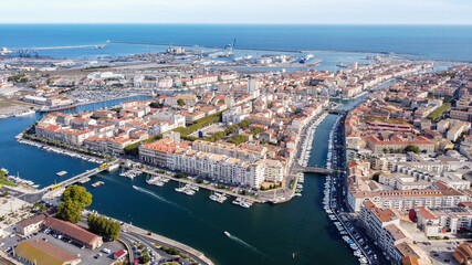 Aerial view of the old town center of Sete in the South of France - Two urbanised islands surrounded with ancient canals between the Mediterranean Sea and the Pond of Thau - obrazy, fototapety, plakaty