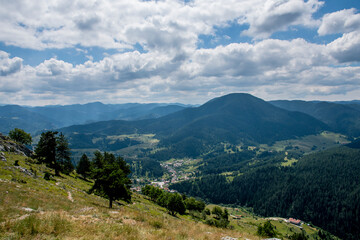 A beautiful nature landscape of the Bulgarian mountains. Below can be seen the little village of Yagodina.
