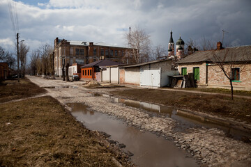 Fototapeta premium Puddles outside on a sunny spring day