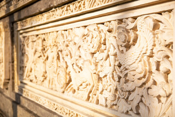 Detail of religious carvings in wall of Lotus temple at Ubud, Bali, Indonesia