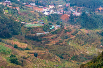 A unique modern football soccer field is seen from above on a plateau in the middle of rice terrace fields in the northern Vietnamese town of Sapa