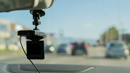 Car video camera (dash cam) inside of car on highway with blurred background of highway road, from perspective of the driver. Concept of safety camera ...	