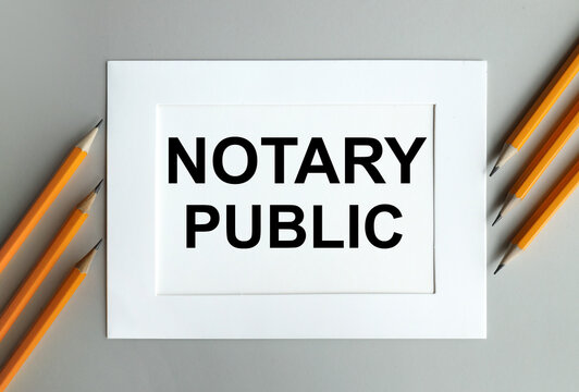 notary public. text on white paper in white frame on gray background