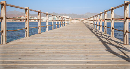 Naklejka premium The background is a beautiful wooden long pier