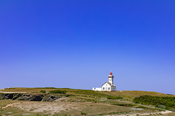 Fototapeta na wymiar Lighthouse of Pointe des Poulains, western coast of Belle-Ile-en-Mer, Brittany, France
