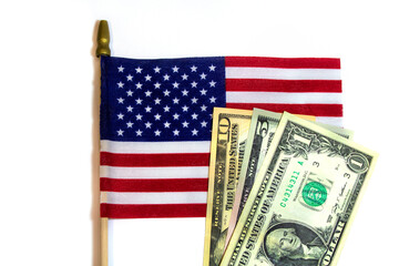 USA dollar banknotes on United States of America or USA flag