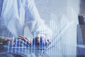 Double exposure of woman hands typing on computer and forex chart hologram drawing. Stock market invest concept.