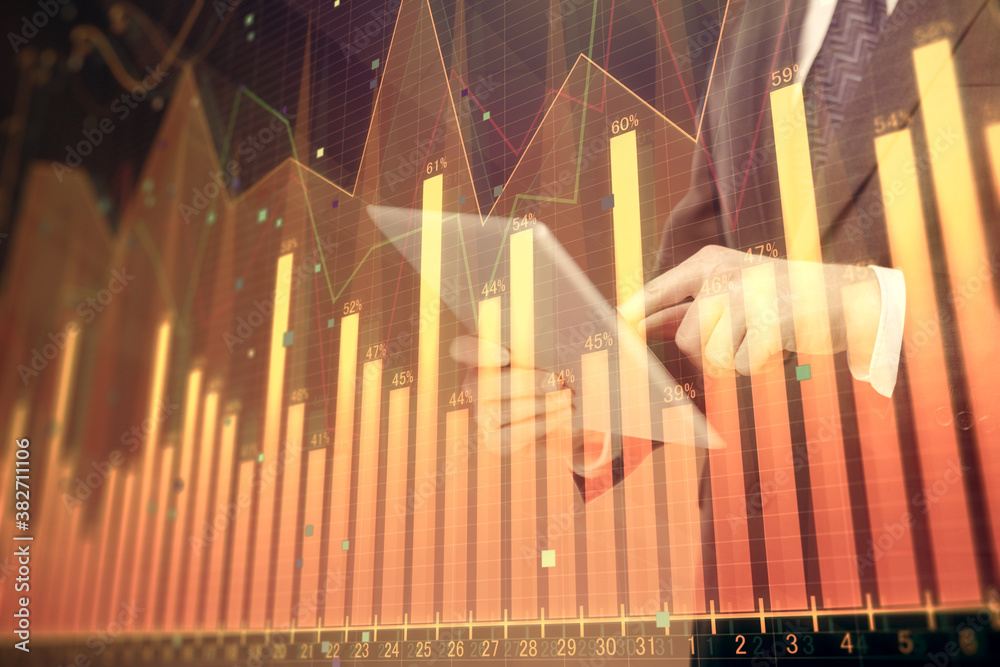 Poster double exposure of man's hands holding and using a digital device and forex graph drawing. financial