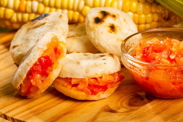 Delicious Colombian corn arepas with hogao - Colombian Breakfast