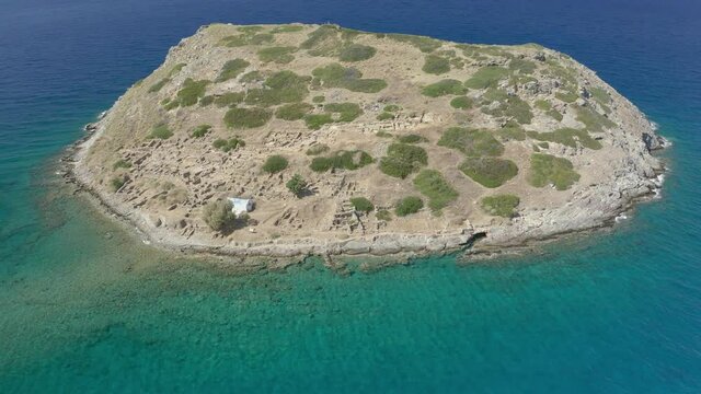 Aerial view of the island of Mochlos containing the ruins of an ancient Minoan city on the Greek island of Crete