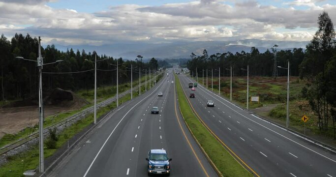 Highway traffic from an overpass on the Pan-American Highway, a wide section south of Quito, Ecuador