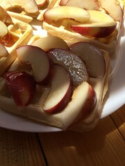 Waffles with peaches and honey on breakfast