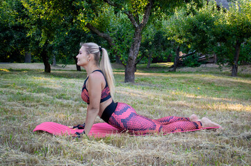 woman doing yoga exercises in the park