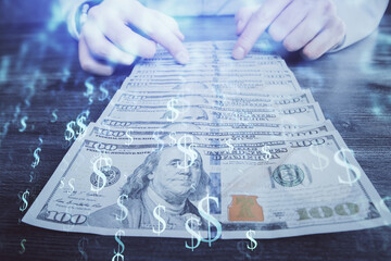 Multi exposure of forex graph drawing hologram and USA dollars bills and man hands. Technical...